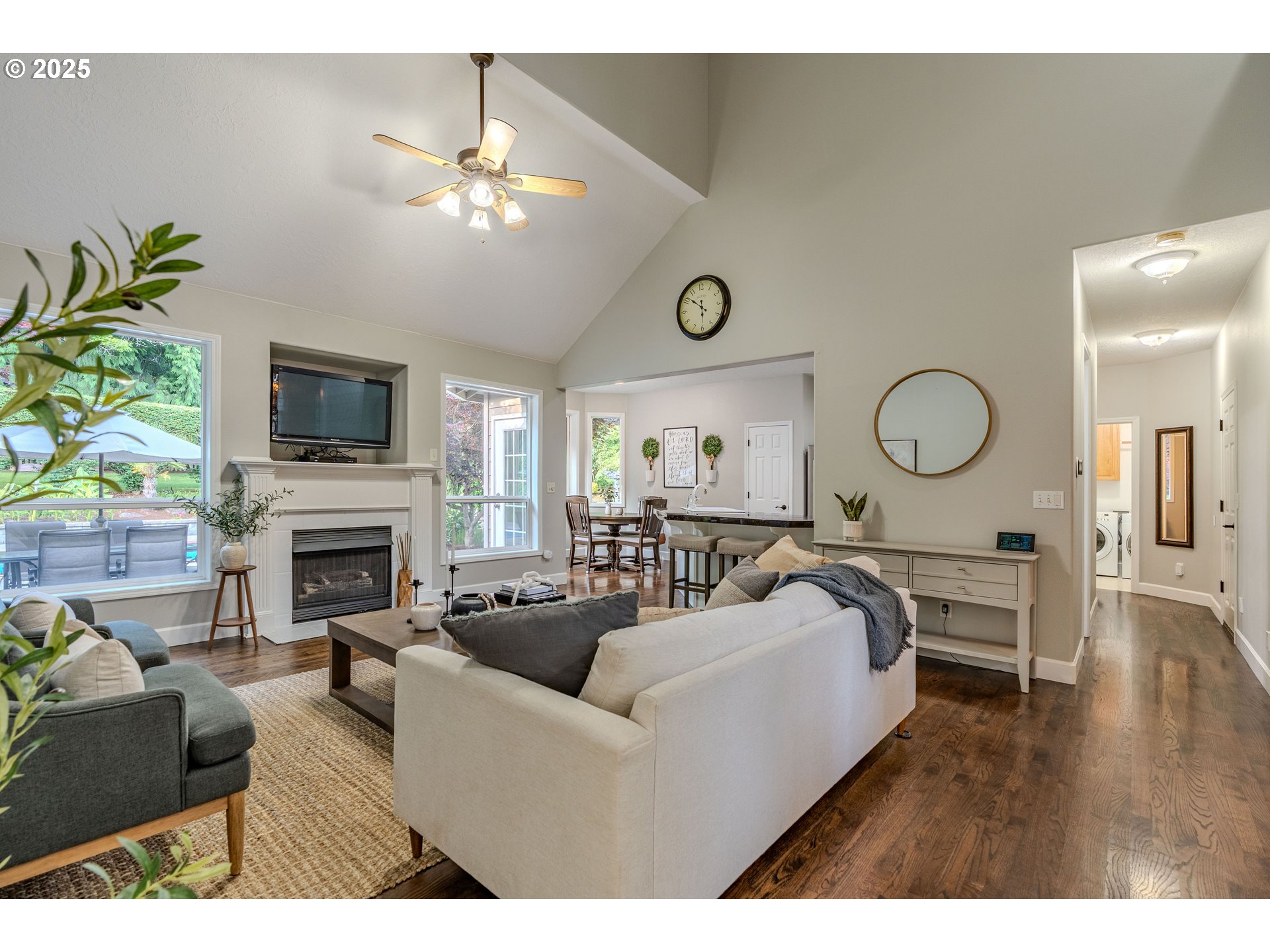 32153 Southeast Bluff Road Gresham, OR 97080 - Photo 7 of 48 a living room with furniture a fireplace and a flat screen tv