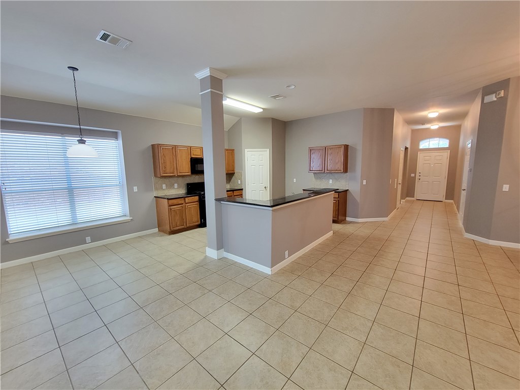 3526 Shiraz Loop Round Rock, TX 78665 - Photo 12 of 18 a view of a kitchen with a sink and cabinets
