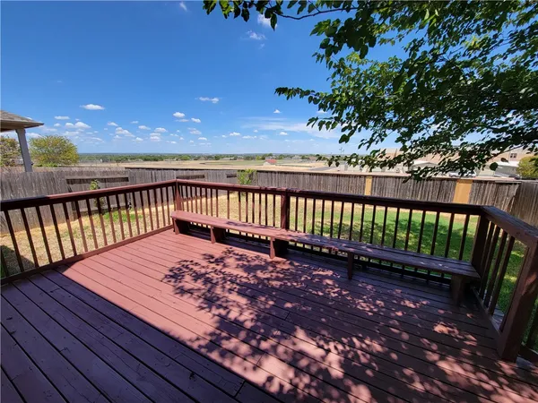 a view of a wooden roof with a garden