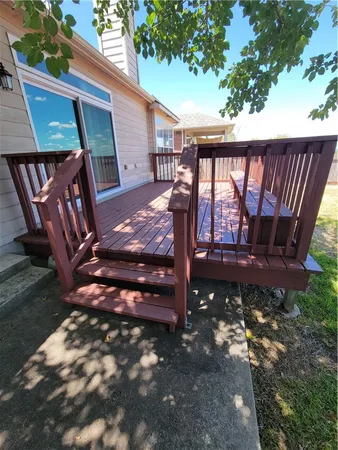 a view of a backyard with a sitting area