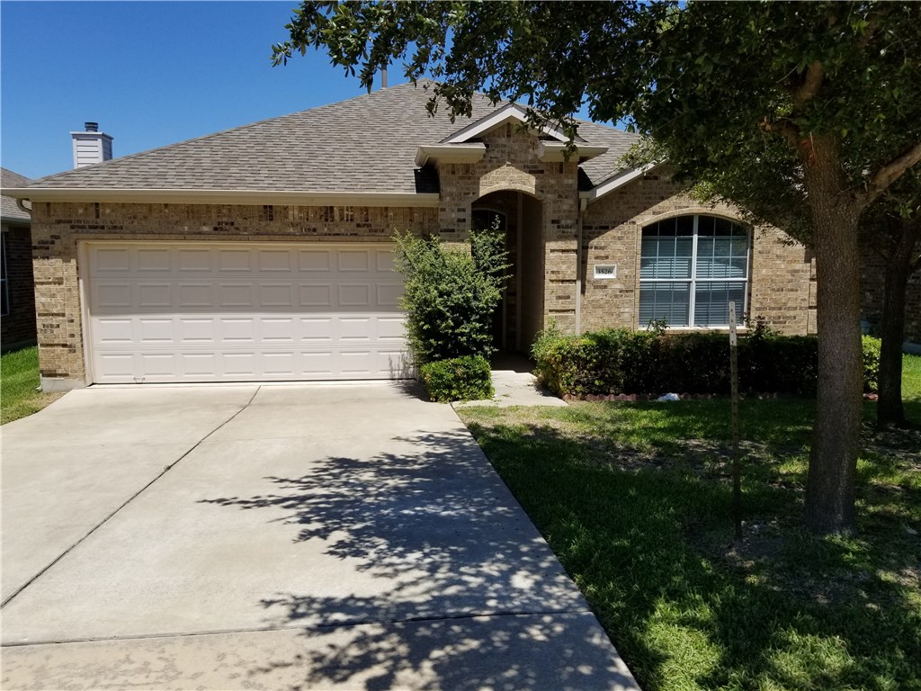 3526 Shiraz Loop Round Rock, TX 78665 - Photo 18 of 18 a front view of a house with garden