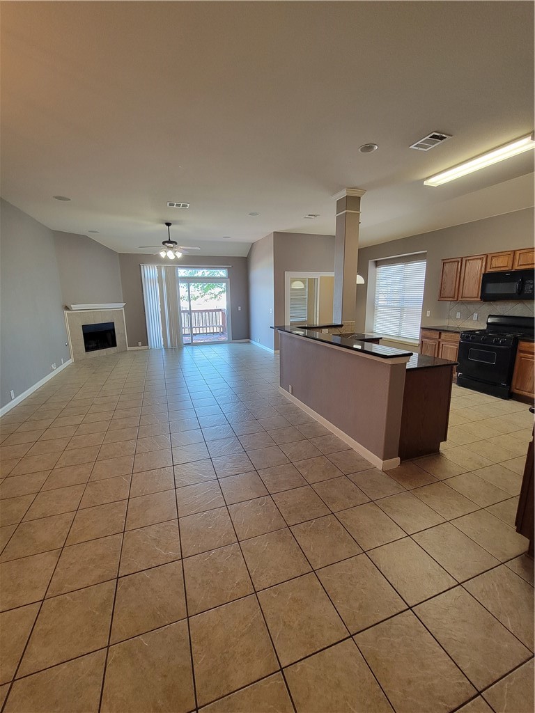 3526 Shiraz Loop Round Rock, TX 78665 - Photo 2 of 18 a large kitchen with cabinets and stainless steel appliances