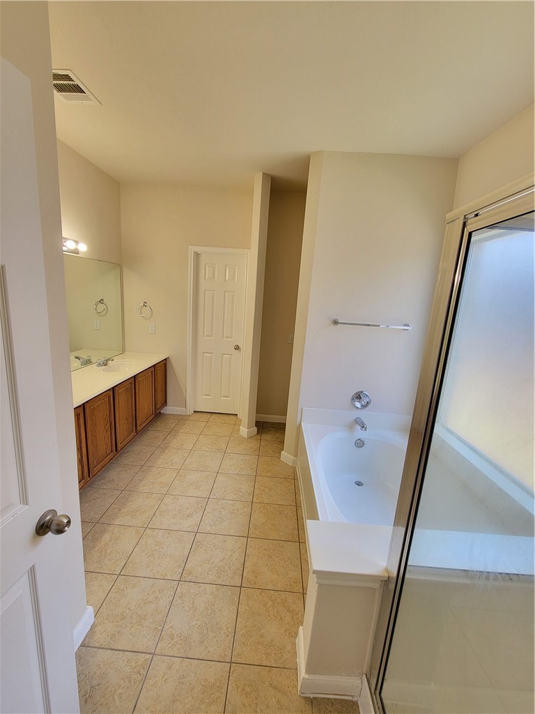 3526 Shiraz Loop Round Rock, TX 78665 - Photo 6 of 18 a bathroom with a sink a toilet and a large mirror