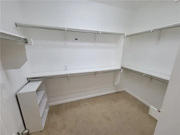 a view of an empty walk in closet