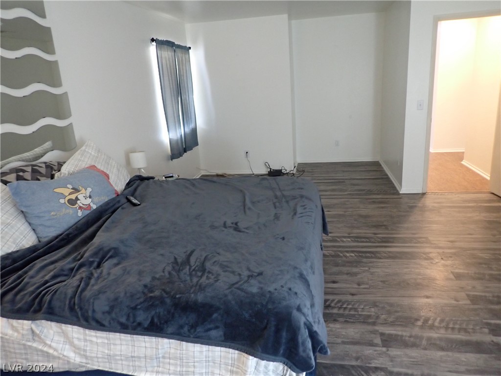 872 Adobe Flat Drive Henderson, NV 89011 - Photo 22 of 44 Large Primary Bedroom With Wood Laminate