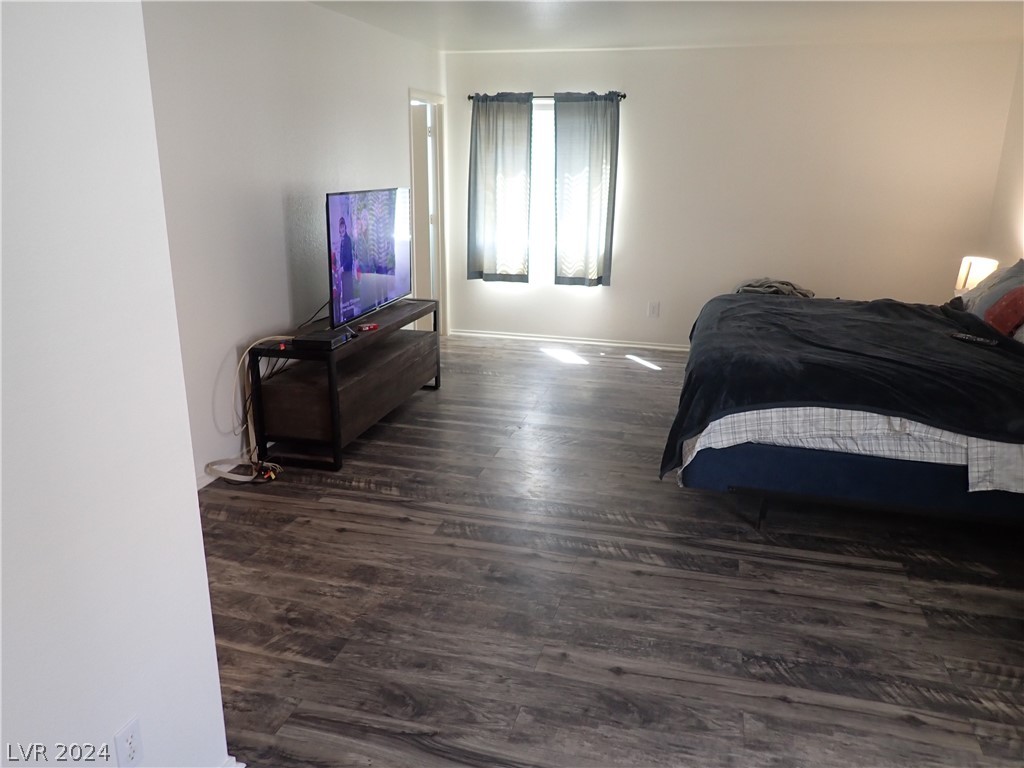 872 Adobe Flat Drive Henderson, NV 89011 - Photo 23 of 44 Large Primary Bedroom With Wood Laminate