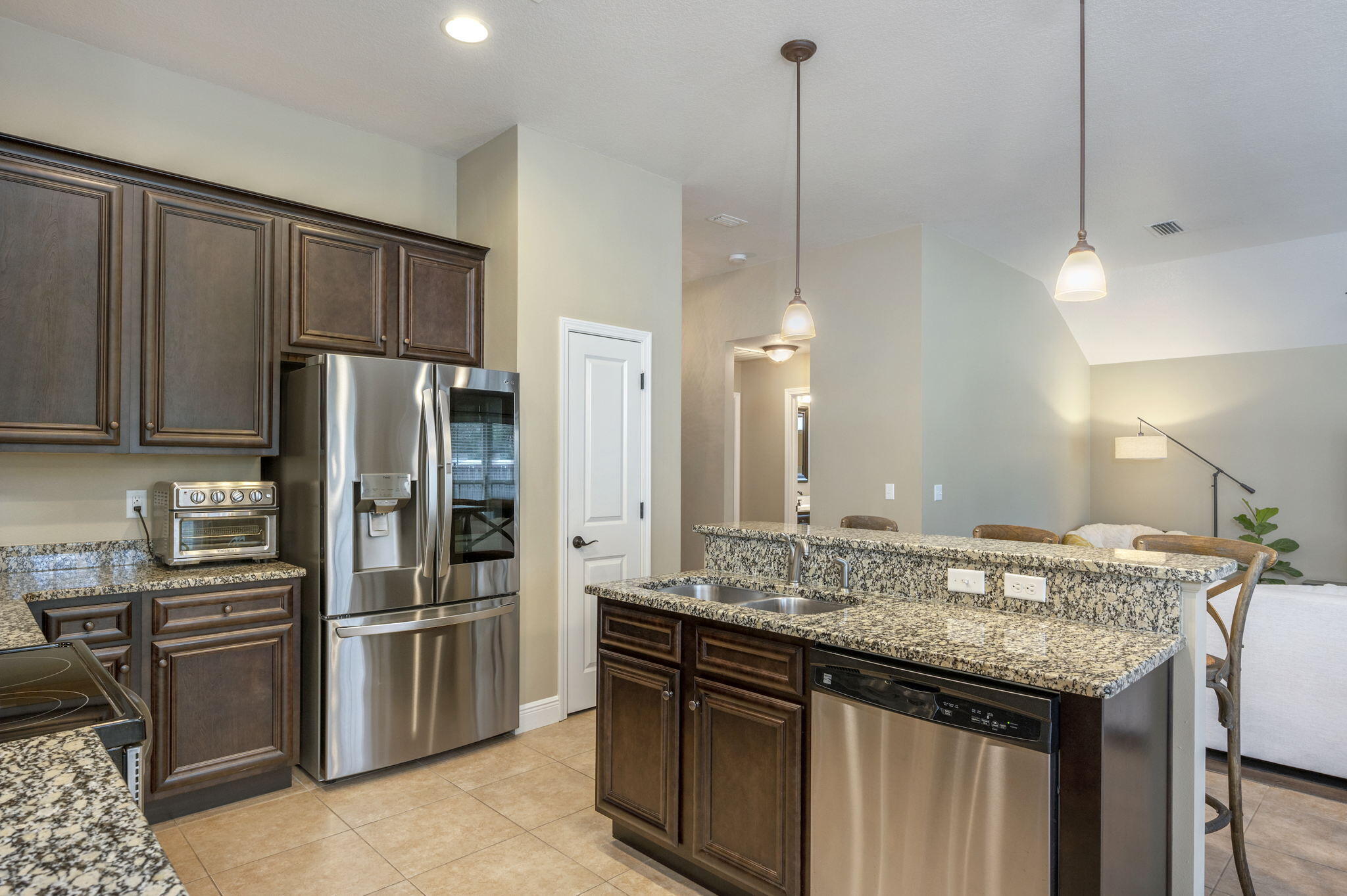 5811 Roberts Road Crestview, FL 32536 - Photo 15 of 35 a kitchen with stainless steel appliances granite countertop a sink refrigerator and cabinets