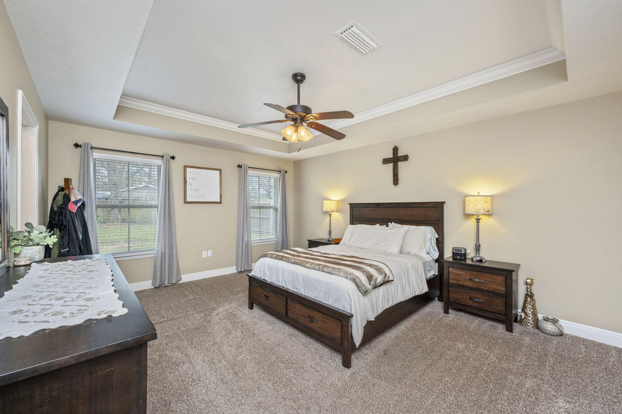 5811 Roberts Road Crestview, FL 32536 - Photo 17 of 35 a spacious bedroom with a bed and dresser with mirror