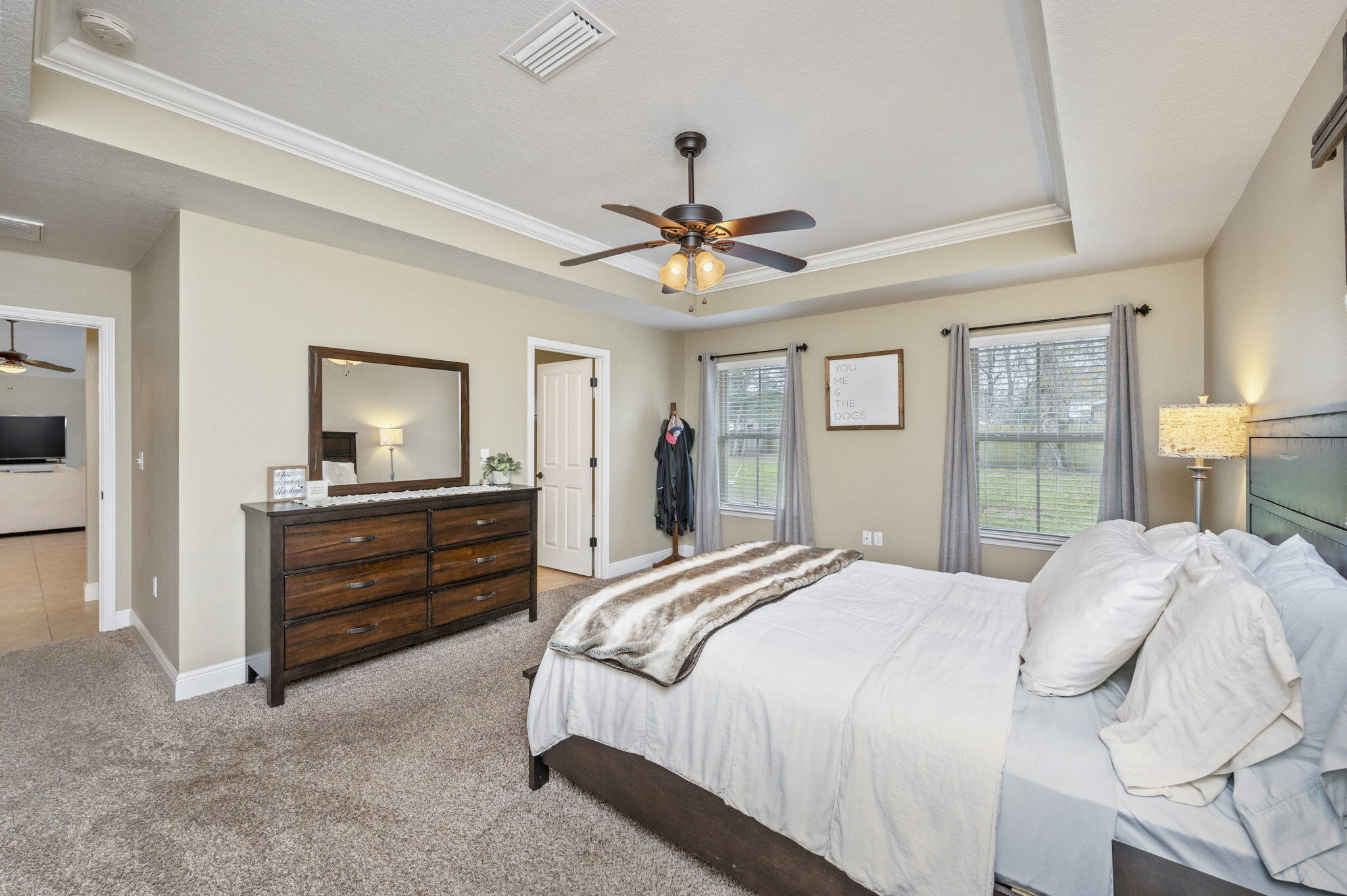 5811 Roberts Road Crestview, FL 32536 - Photo 18 of 35 a bedroom with a bed and a chandelier