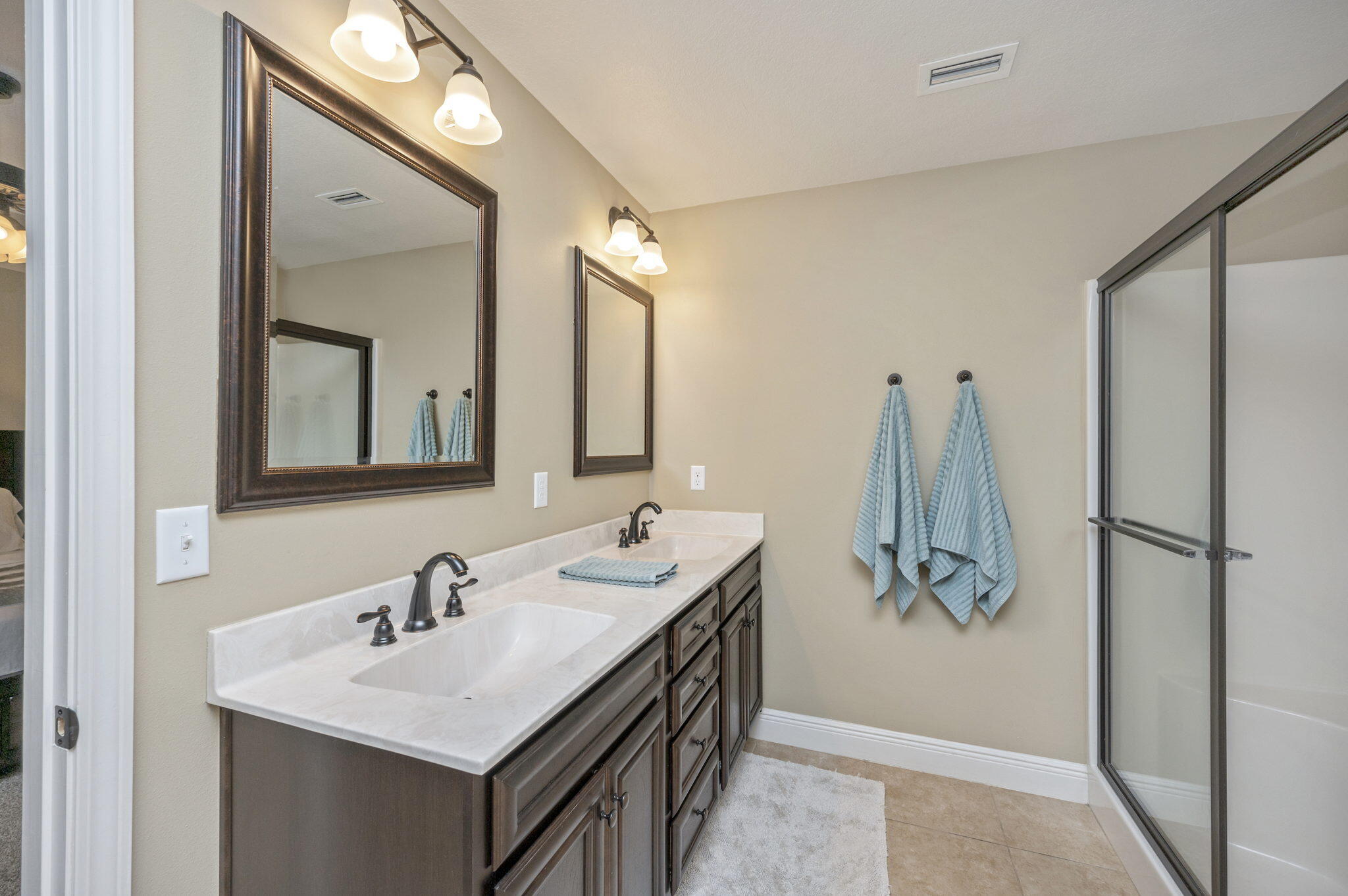 5811 Roberts Road Crestview, FL 32536 - Photo 19 of 35 a bathroom with a double vanity sink and mirror