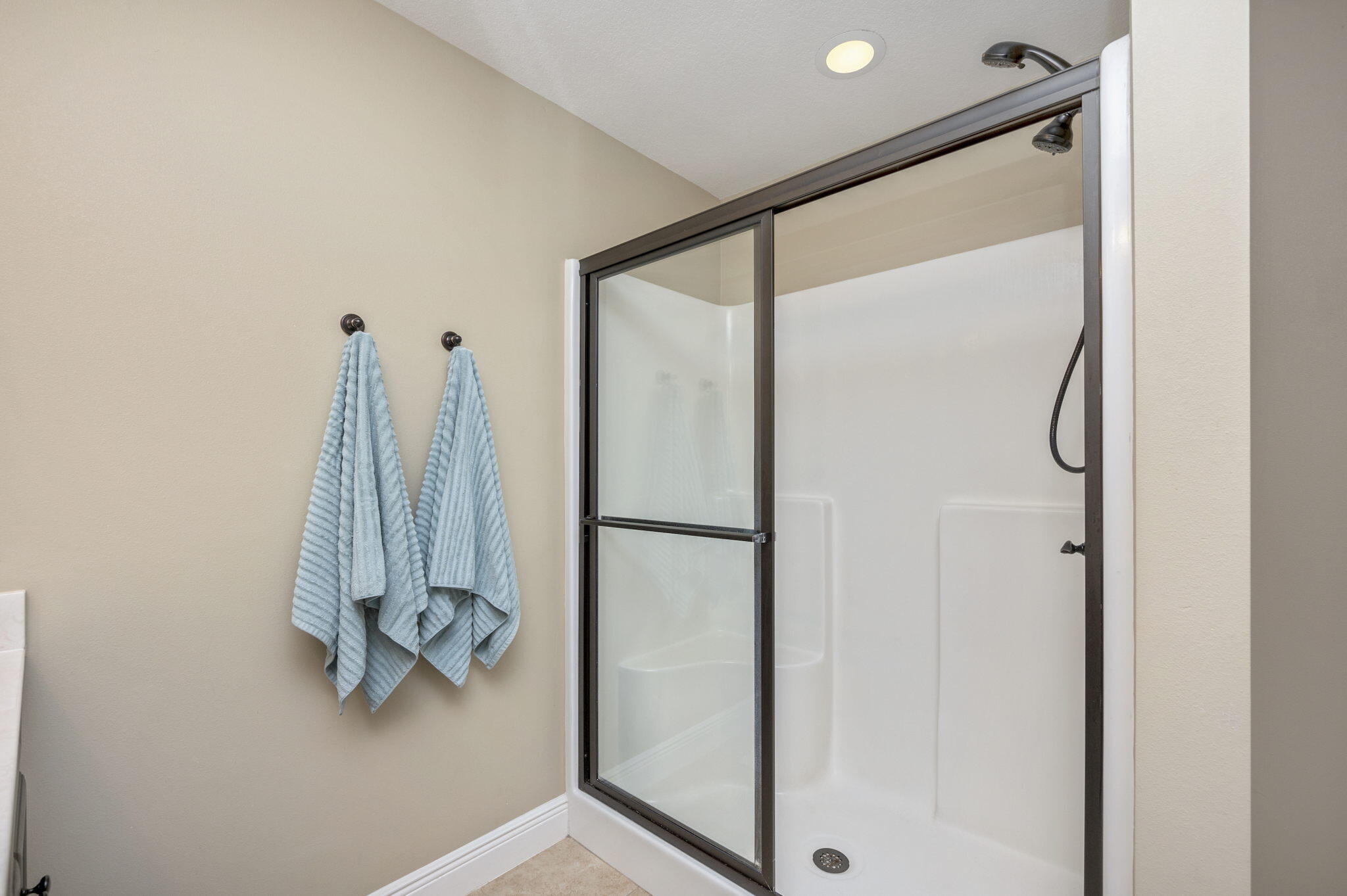 5811 Roberts Road Crestview, FL 32536 - Photo 20 of 35 a bathroom with a glass shower door