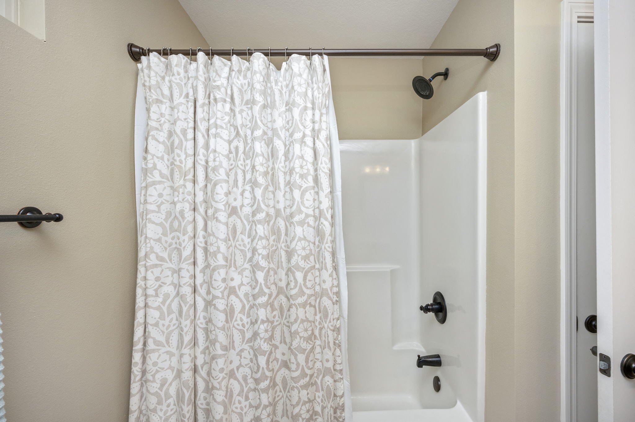 5811 Roberts Road Crestview, FL 32536 - Photo 28 of 35 a bathroom with a shower curtain and a curtain