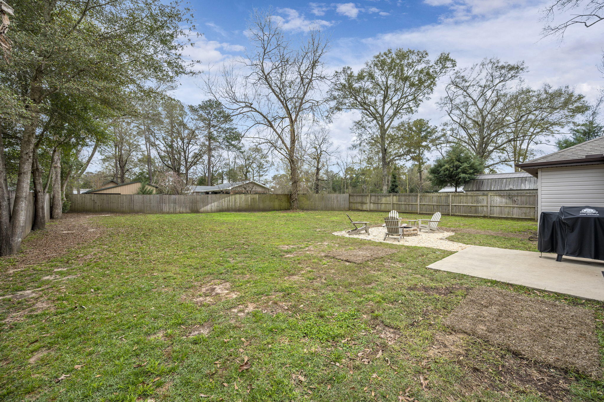 5811 Roberts Road Crestview, FL 32536 - Photo 5 of 35 a view of a lake with a house in the background