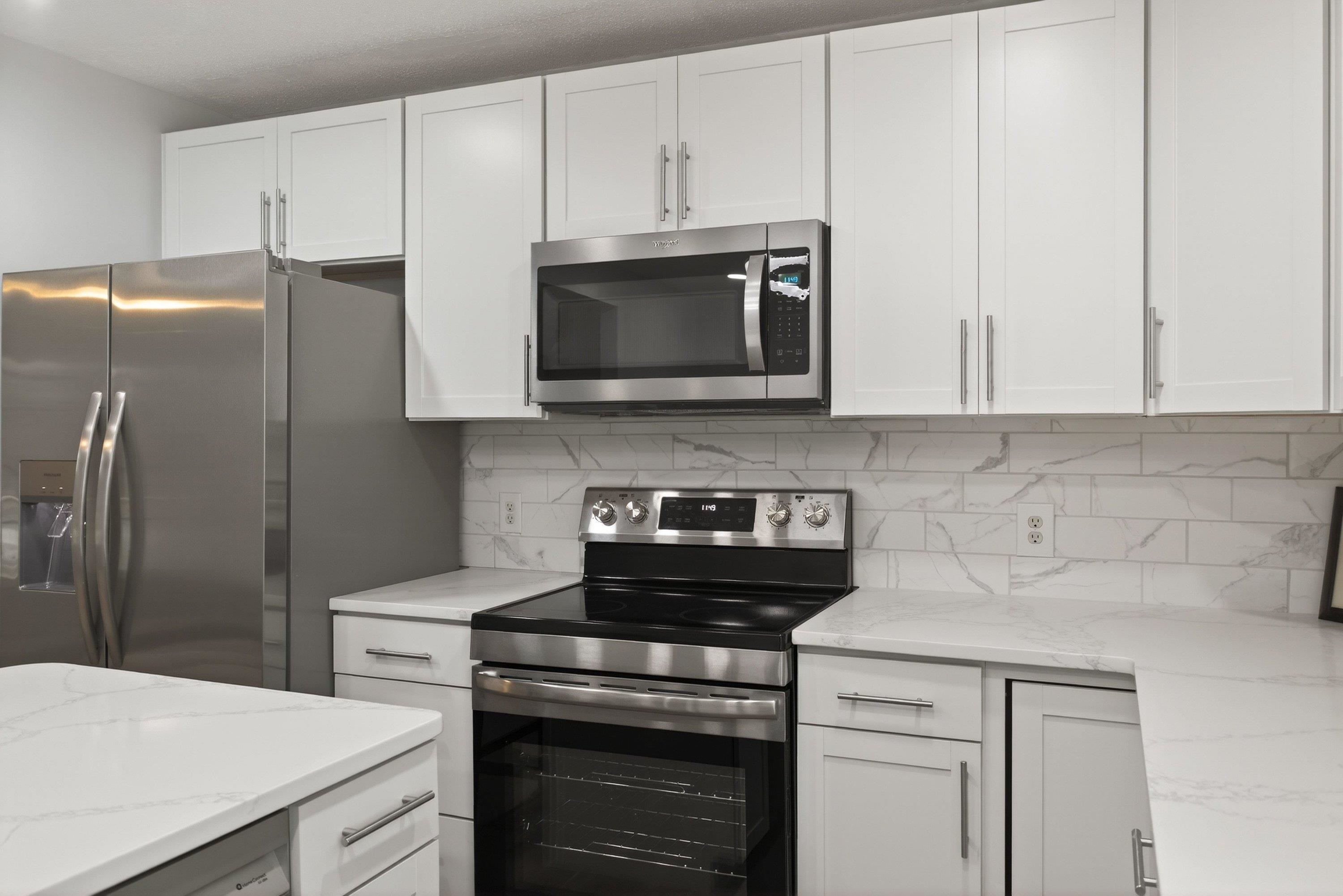 178 Suter Street Harrisonburg, VA 22802 - Photo 14 of 73 a kitchen with stainless steel appliances a stove microwave and refrigerator
