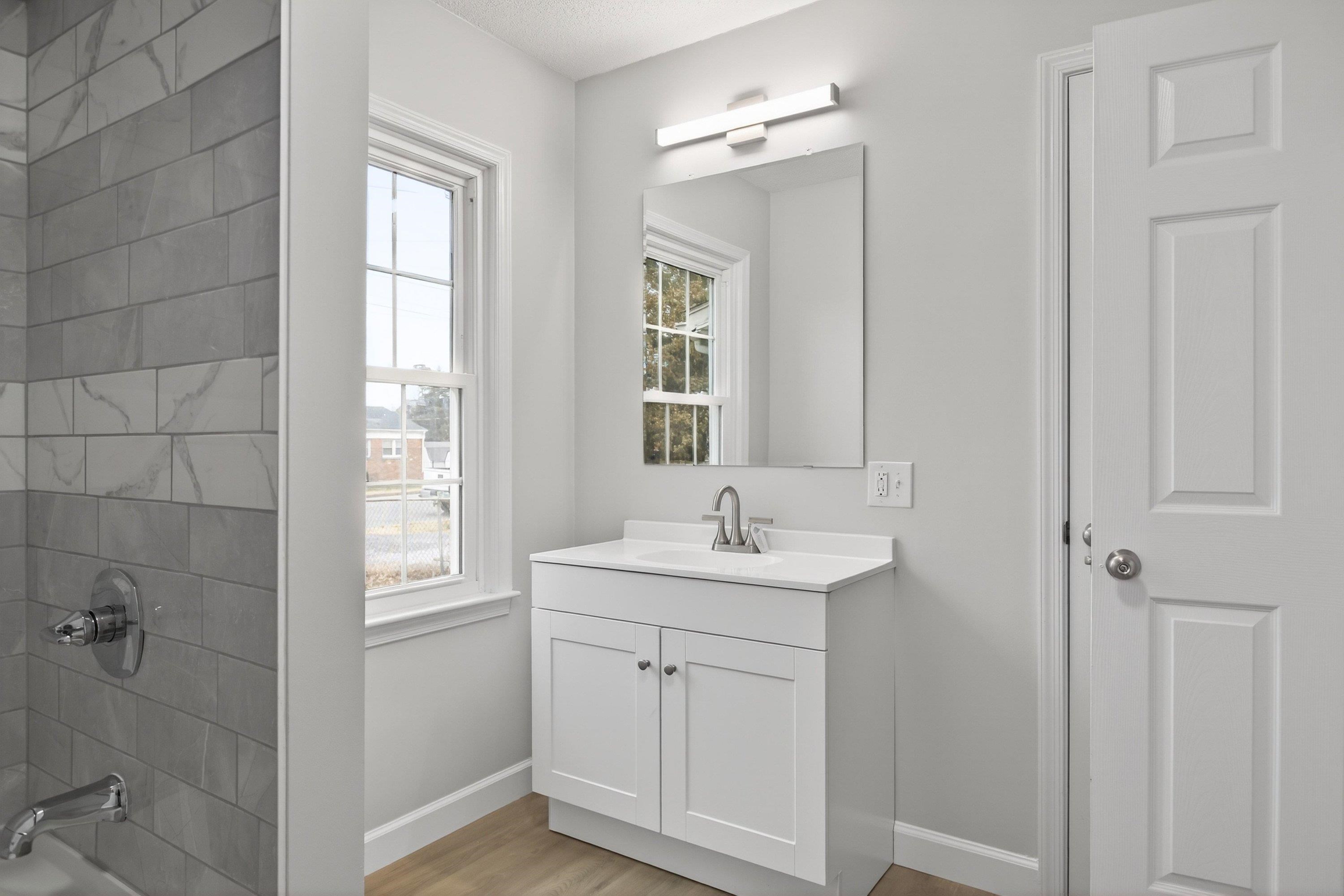 178 Suter Street Harrisonburg, VA 22802 - Photo 20 of 73 This spacious full bathroom offers a tile shower/bathtub area, luxury vinyl plank flooring, vanity with storage, and space for full-size washer & dryer hookups.