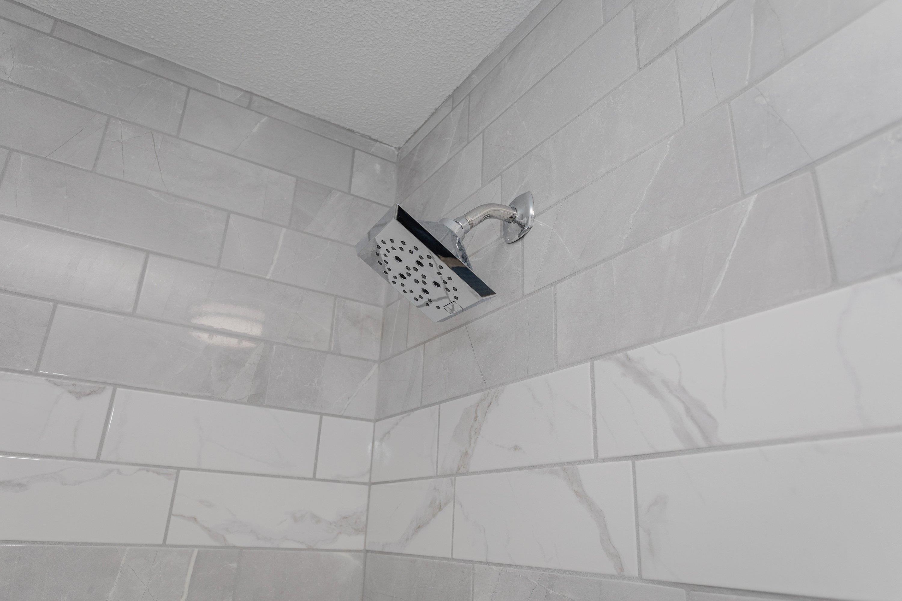 178 Suter Street Harrisonburg, VA 22802 - Photo 22 of 73 This spacious full bathroom offers a tile shower/bathtub area, luxury vinyl plank flooring, vanity with storage, and space for full-size washer & dryer hookups.