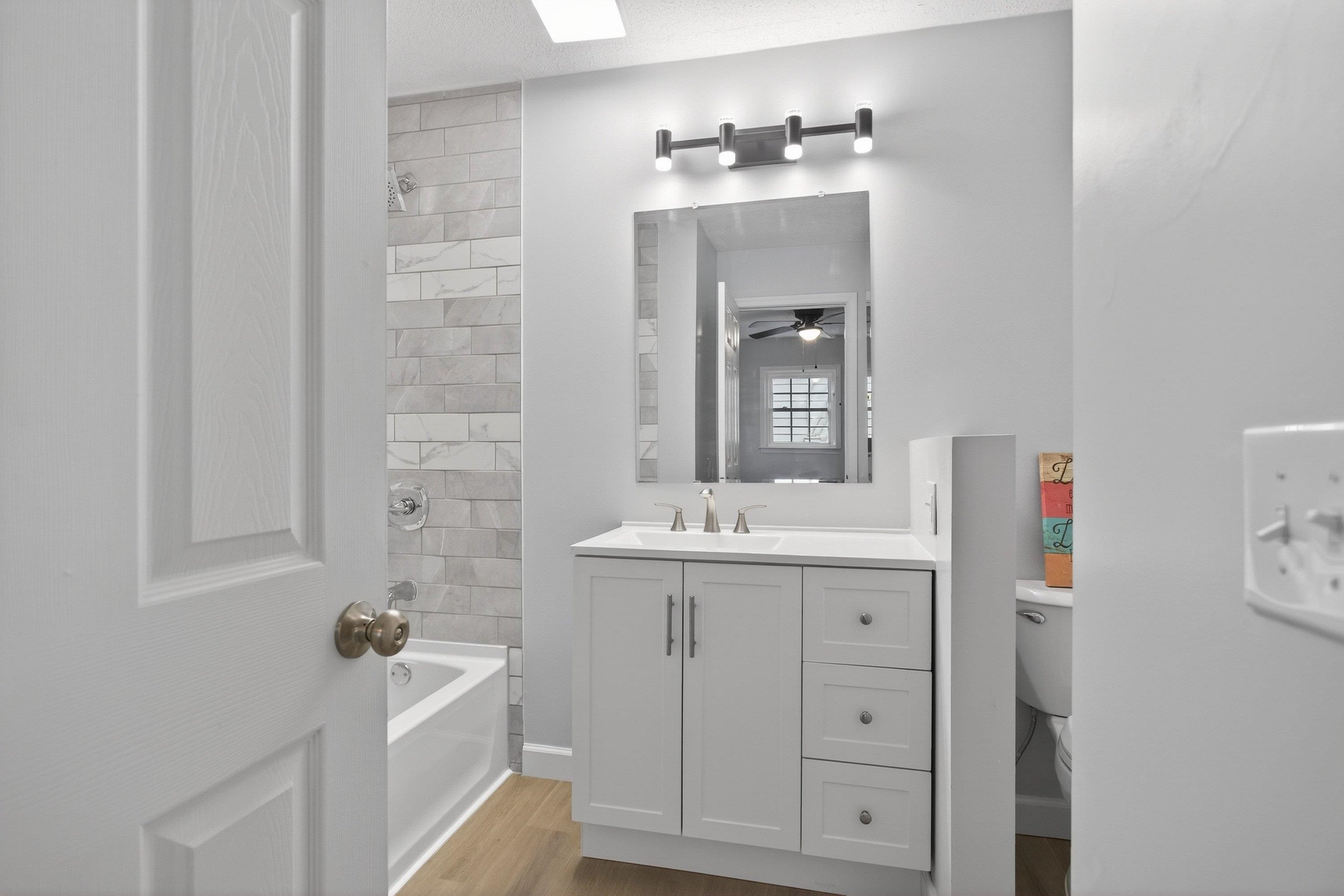 178 Suter Street Harrisonburg, VA 22802 - Photo 26 of 73 a bathroom with a sink vanity granite tub and shower