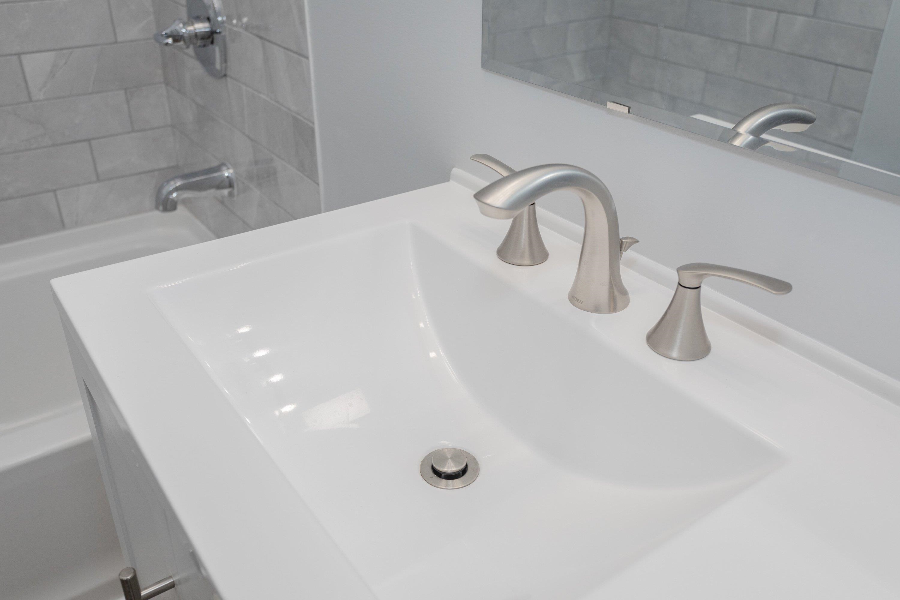178 Suter Street Harrisonburg, VA 22802 - Photo 28 of 73 a close view of a sink a faucet a toilet and a shower in a bathroom