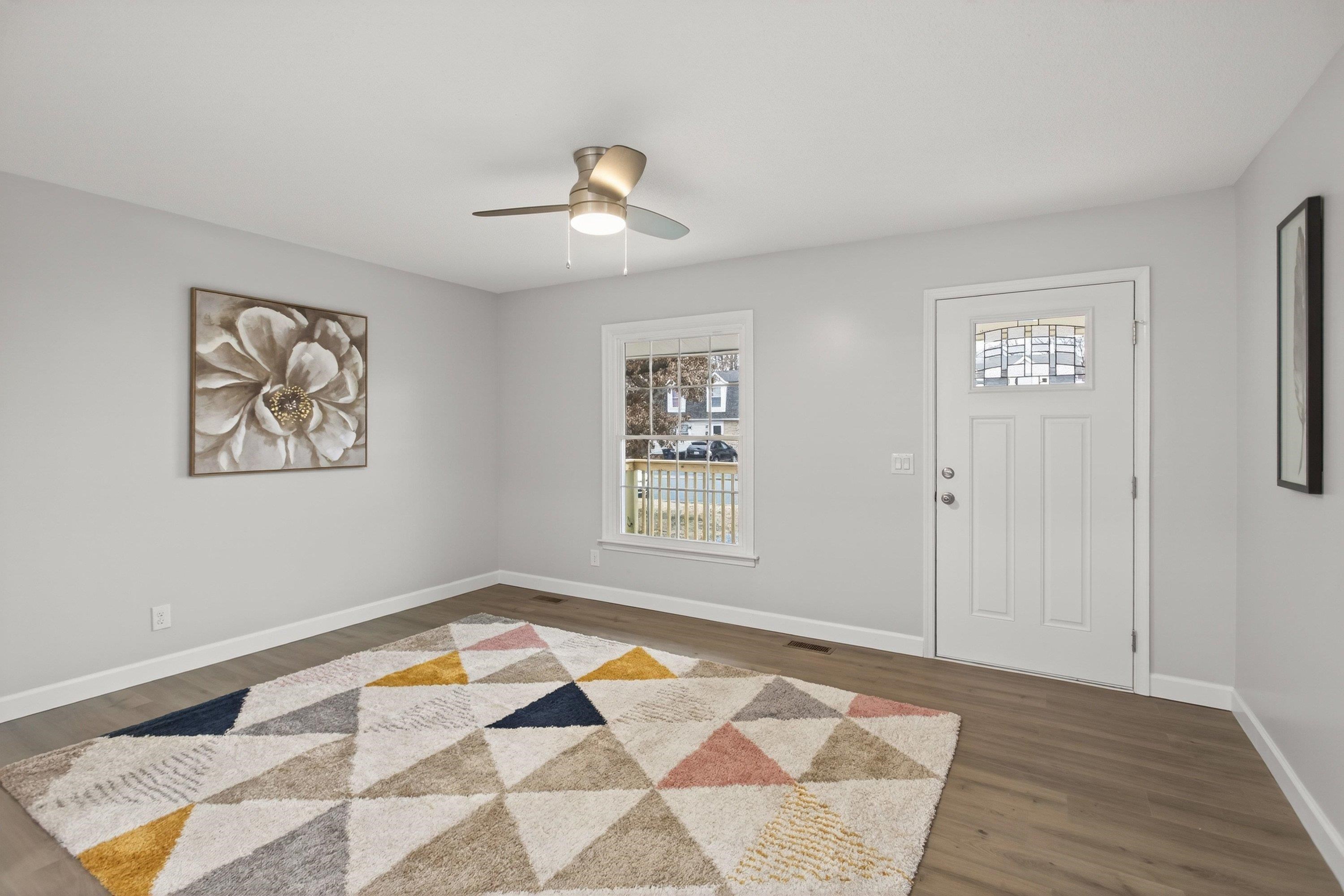 178 Suter Street Harrisonburg, VA 22802 - Photo 5 of 73 a view of an empty room with a window and wooden floor