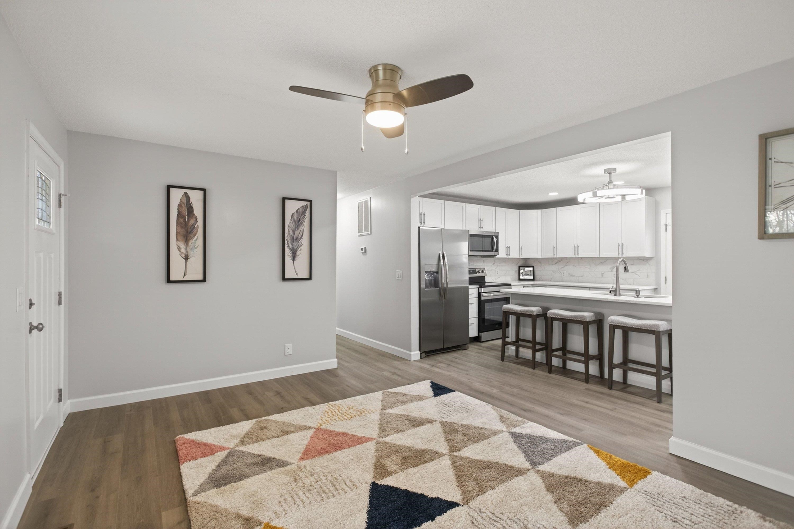 178 Suter Street Harrisonburg, VA 22802 - Photo 7 of 73 a open kitchen with stainless steel appliances kitchen island granite countertop a refrigerator and microwave
