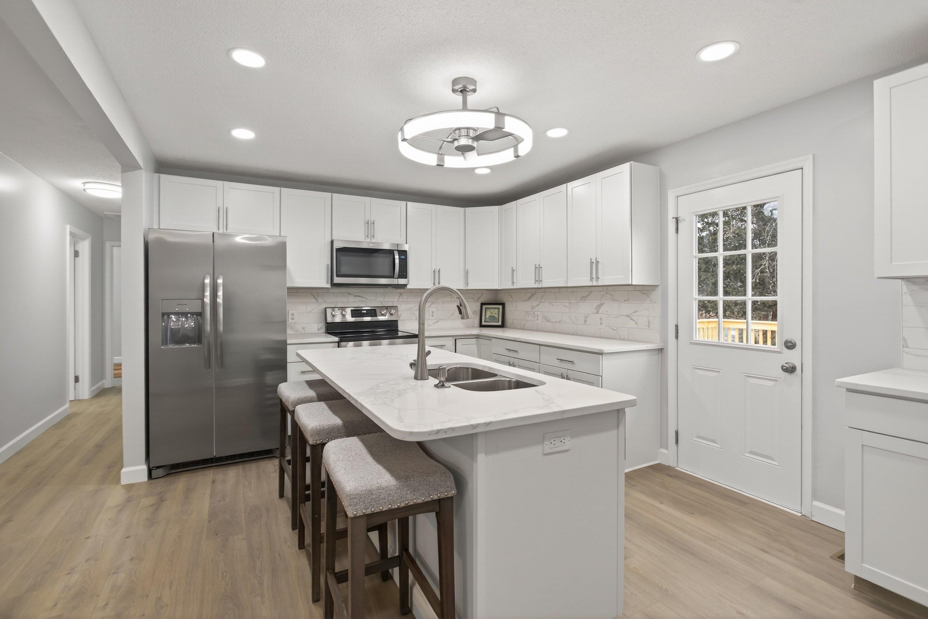 178 Suter Street Harrisonburg, VA 22802 - Photo 10 of 73 a kitchen with a refrigerator a sink cabinets and wooden floor