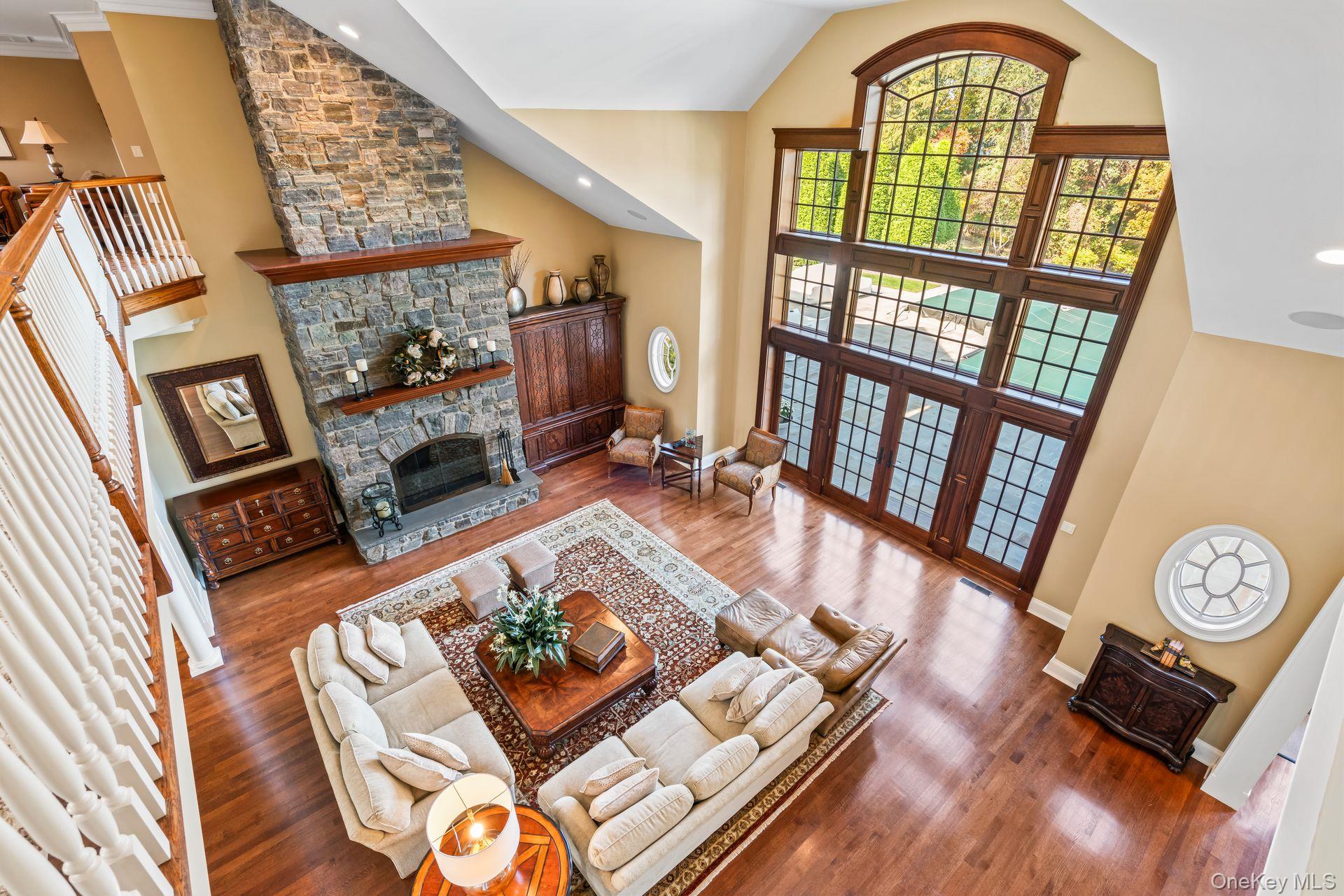 697 Short Beach Road Nissequogue, NY 11780 - Photo 15 of 46 a living room with furniture and a floor to ceiling window