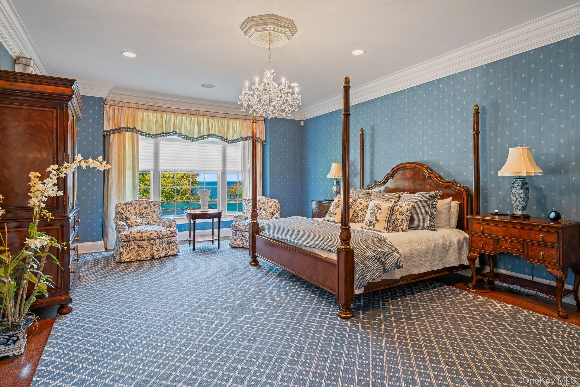 697 Short Beach Road Nissequogue, NY 11780 - Photo 22 of 46 a bedroom with furniture and a large window