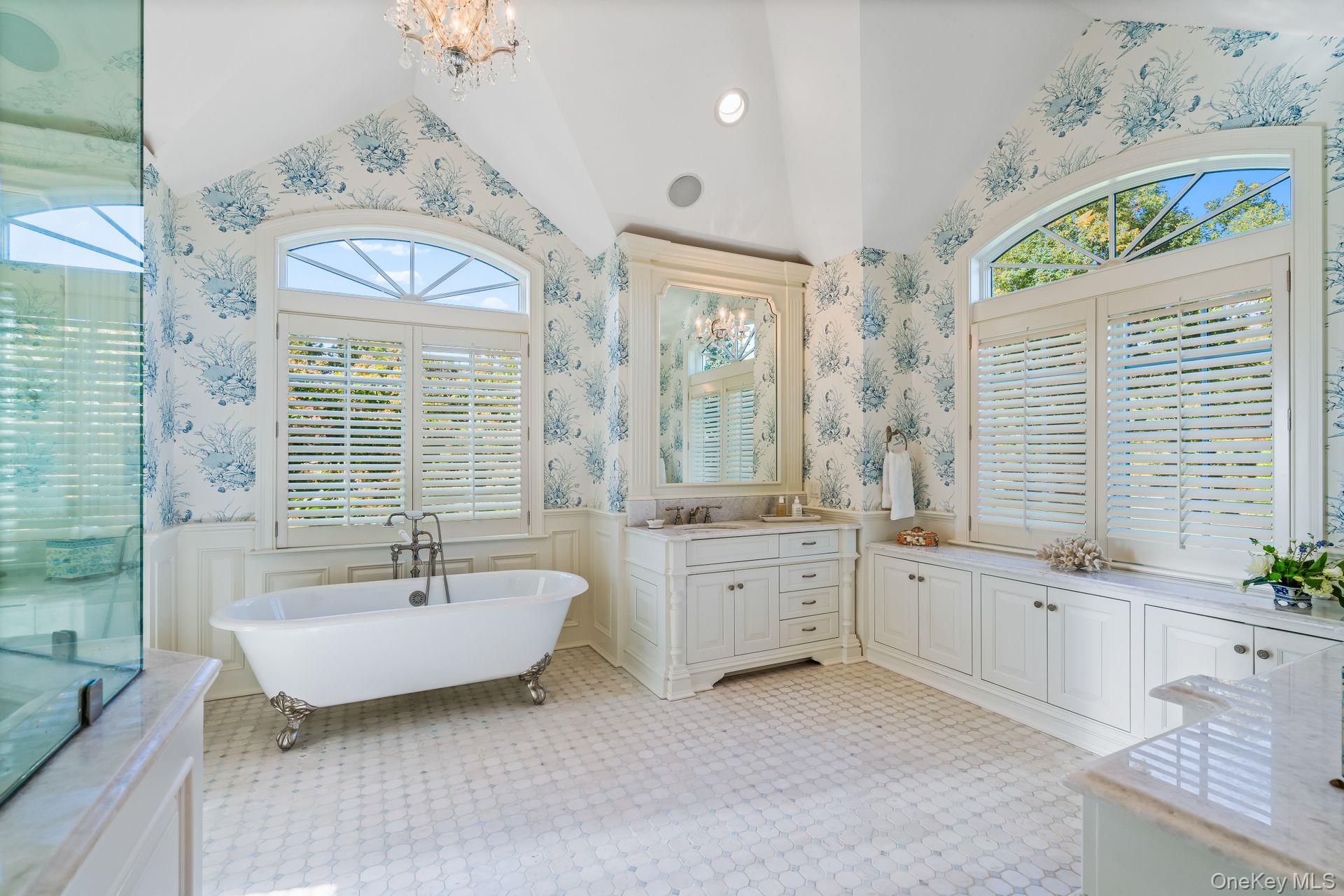697 Short Beach Road Nissequogue, NY 11780 - Photo 23 of 46 a spacious bathroom with a double vanity sink a mirror and a bathtub