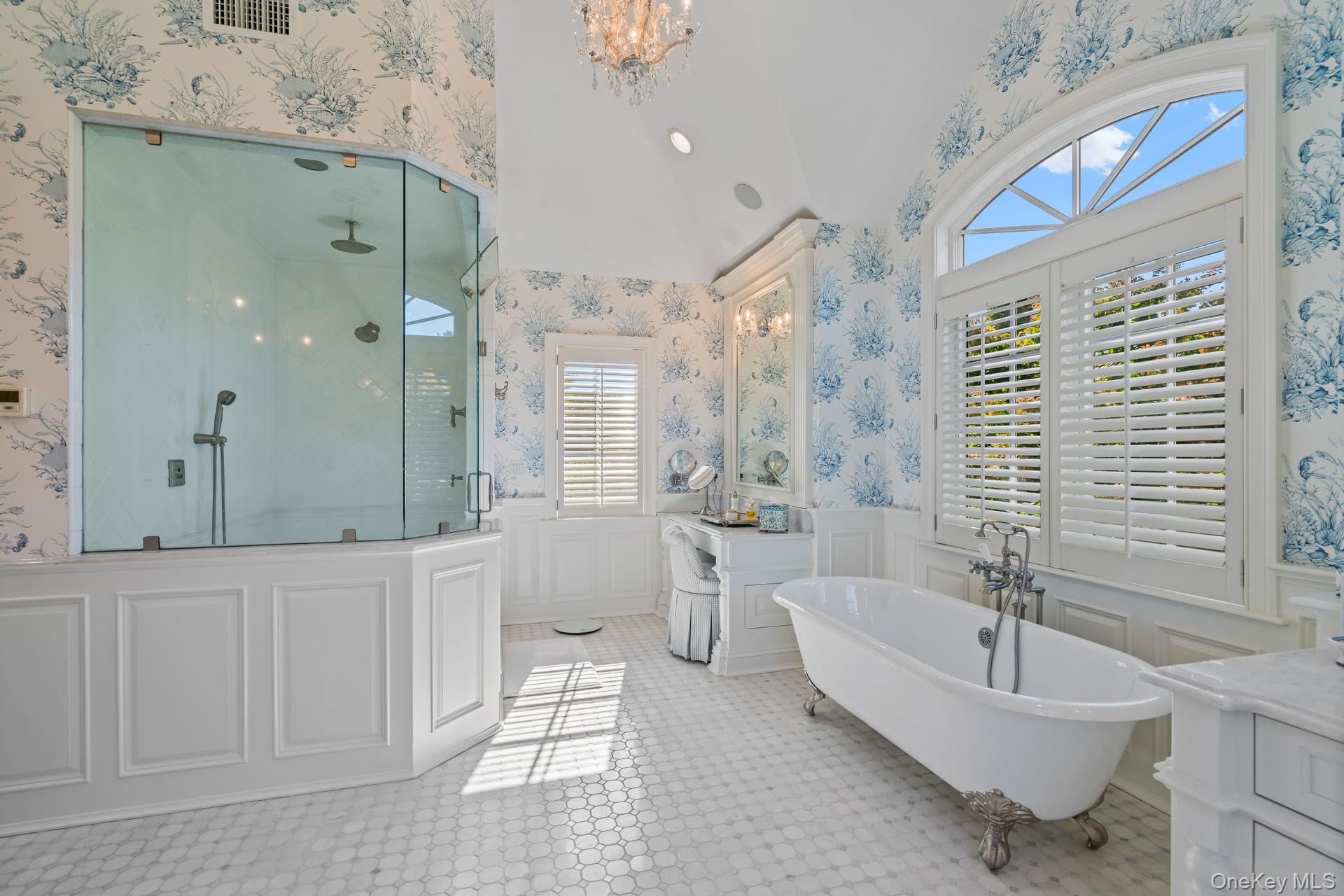697 Short Beach Road Nissequogue, NY 11780 - Photo 24 of 46 a bathroom with a bathtub a sink a mirror and a shower