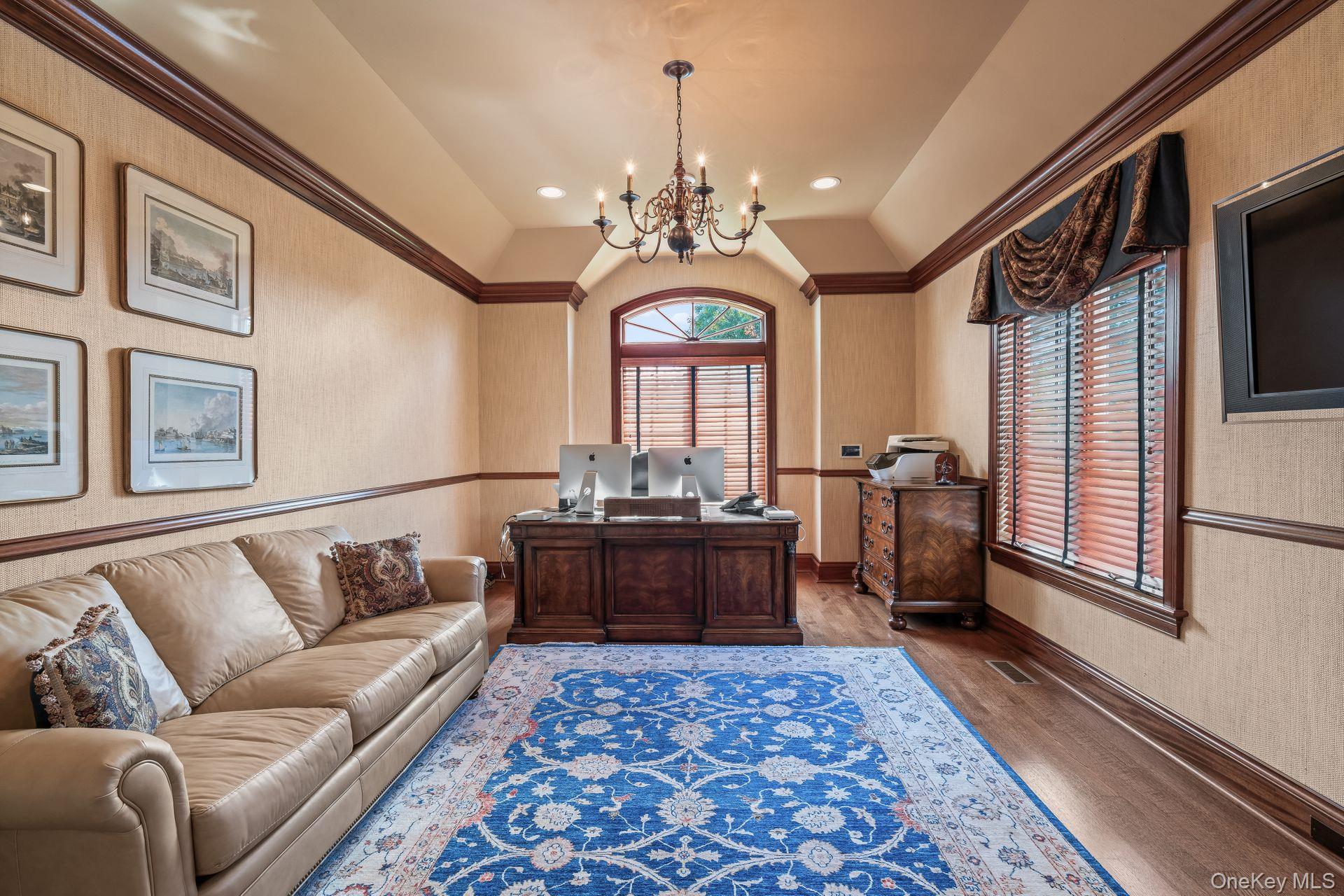 697 Short Beach Road Nissequogue, NY 11780 - Photo 25 of 46 a living room with furniture and a chandelier