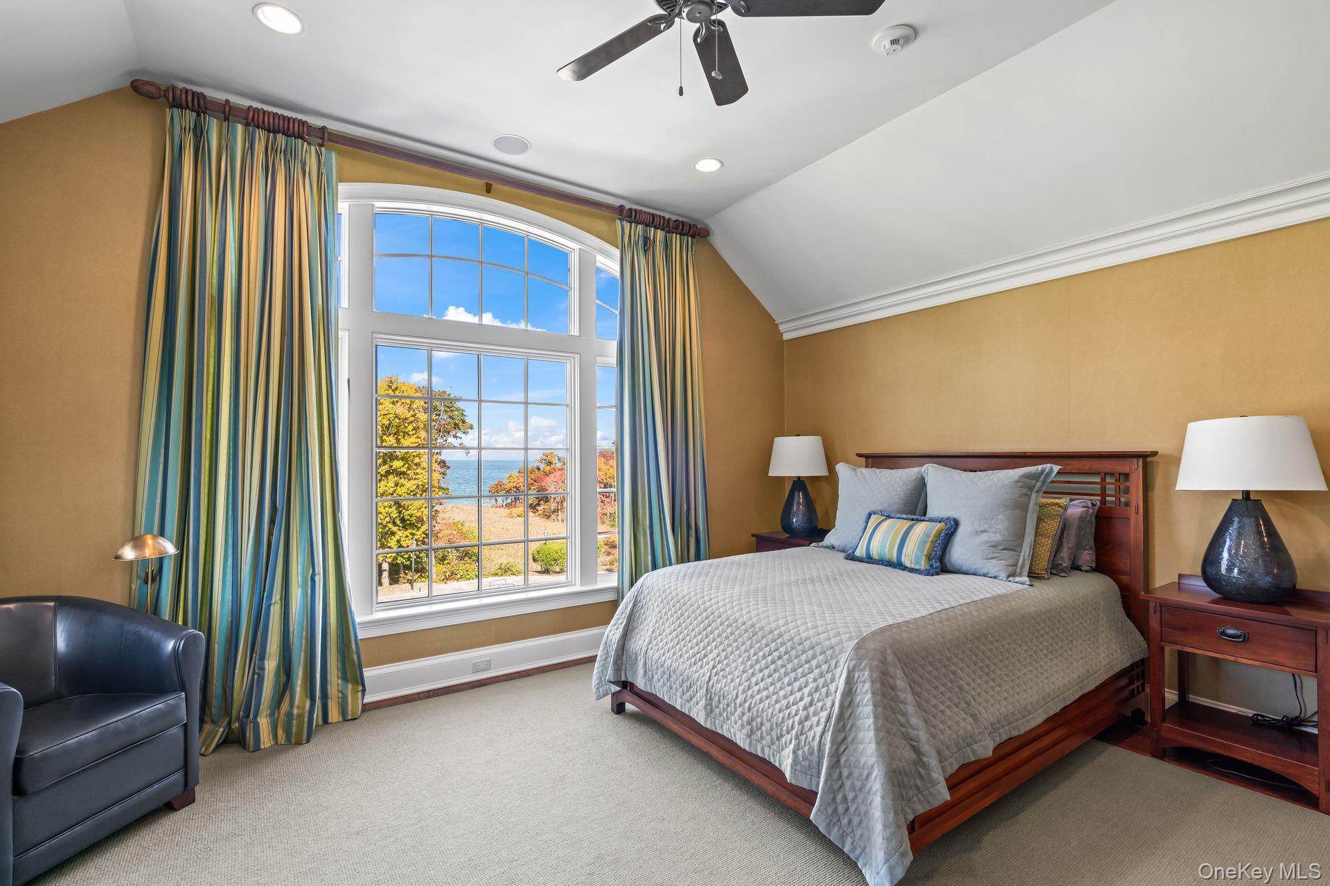 697 Short Beach Road Nissequogue, NY 11780 - Photo 27 of 46 a bedroom with a bed and a couch