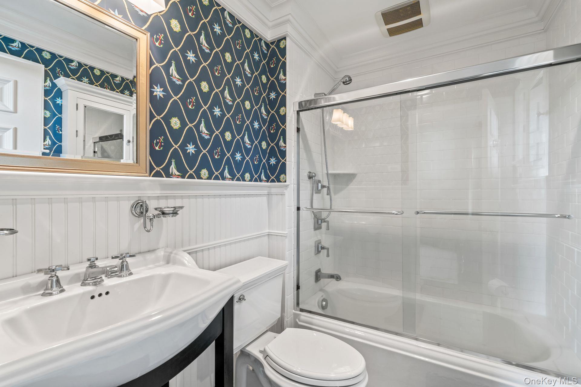 697 Short Beach Road Nissequogue, NY 11780 - Photo 28 of 46 a bathroom with a sink mirror bathtub and toilet