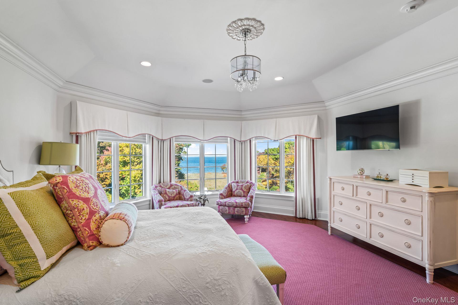 697 Short Beach Road Nissequogue, NY 11780 - Photo 33 of 46 a bedroom with furniture and a flat screen tv