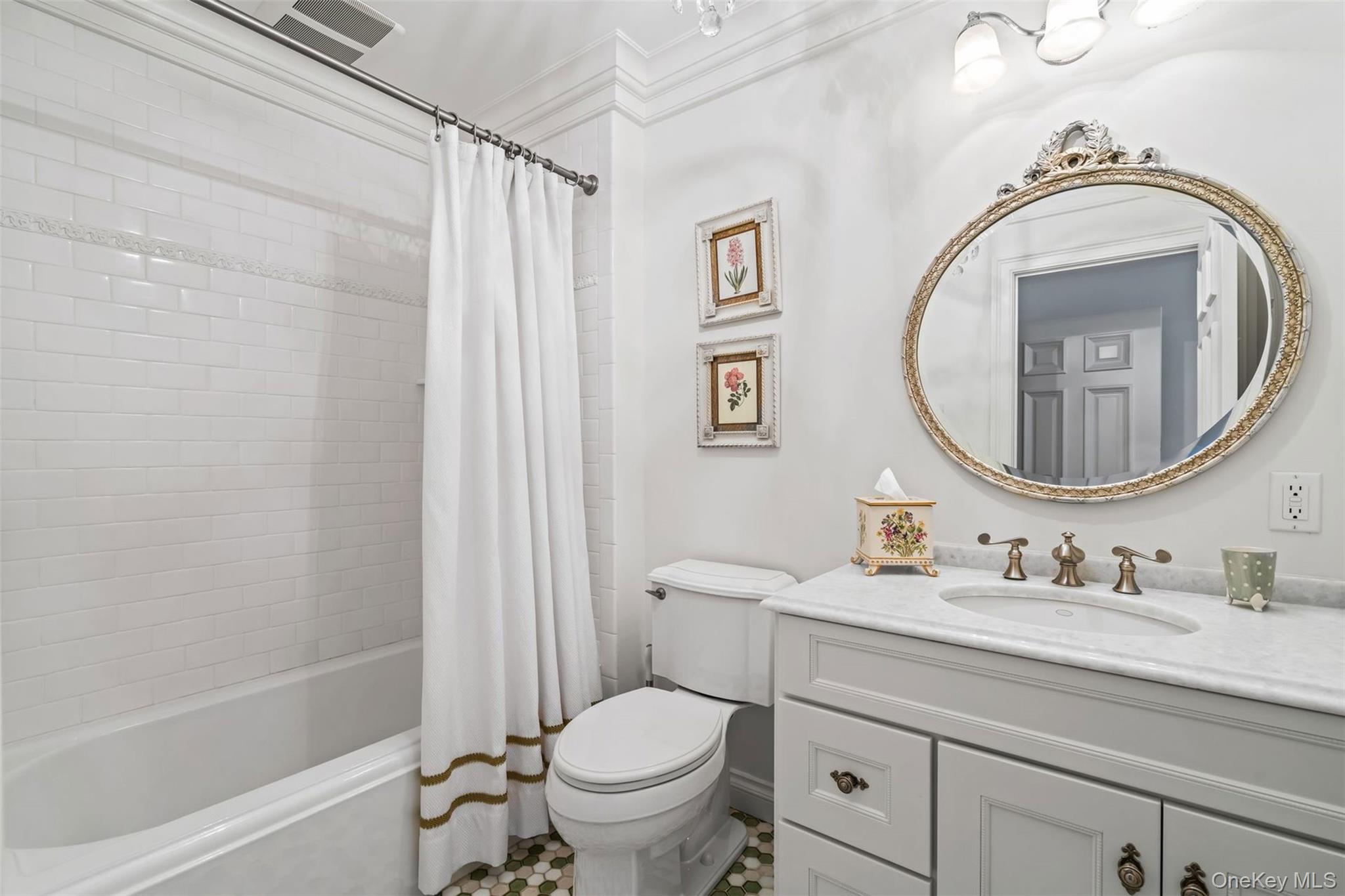 697 Short Beach Road Nissequogue, NY 11780 - Photo 34 of 46 a bathroom with a granite countertop toilet sink and mirror