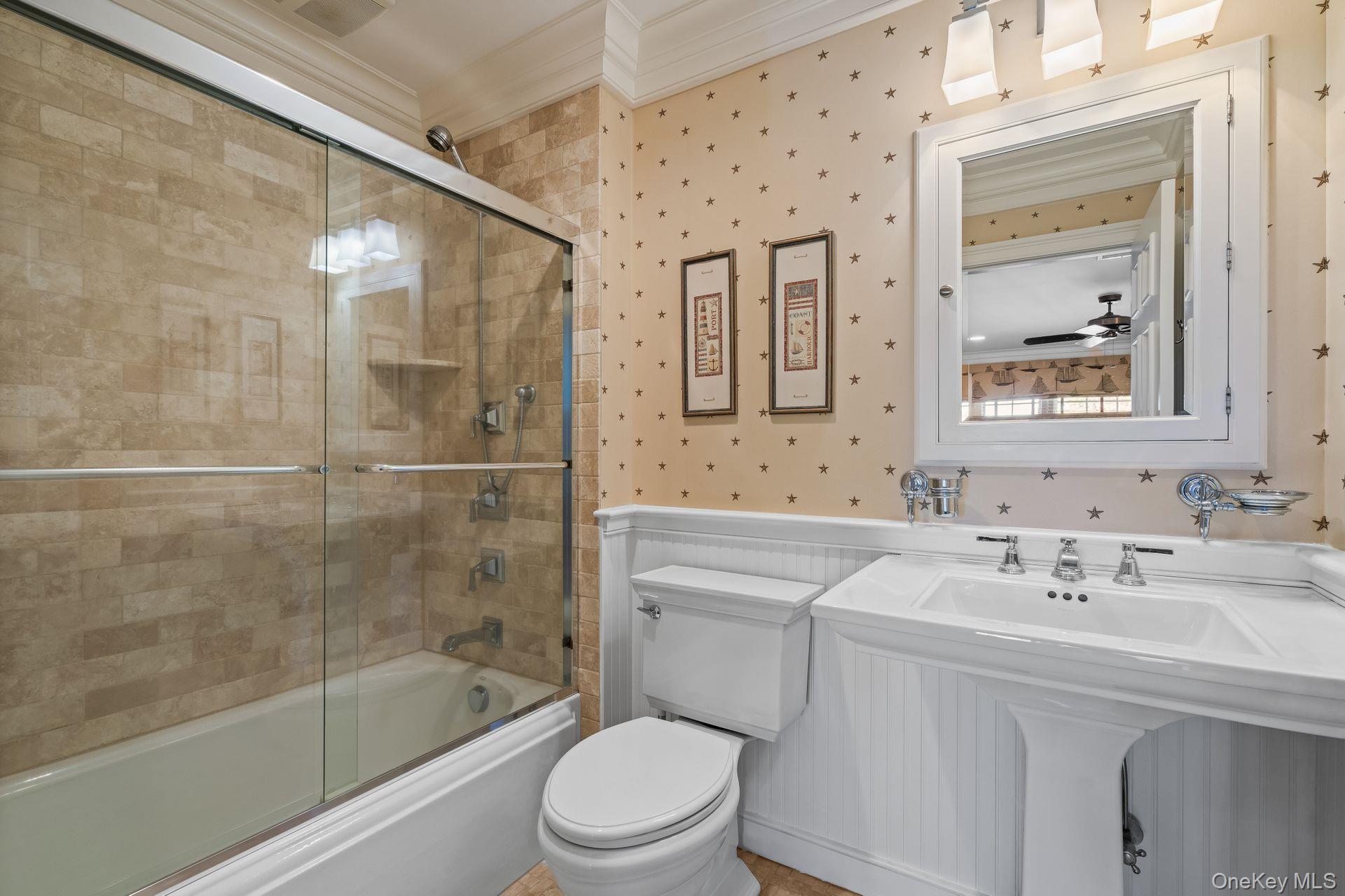 697 Short Beach Road Nissequogue, NY 11780 - Photo 36 of 46 a bathroom with a sink mirror toilet and bathtub