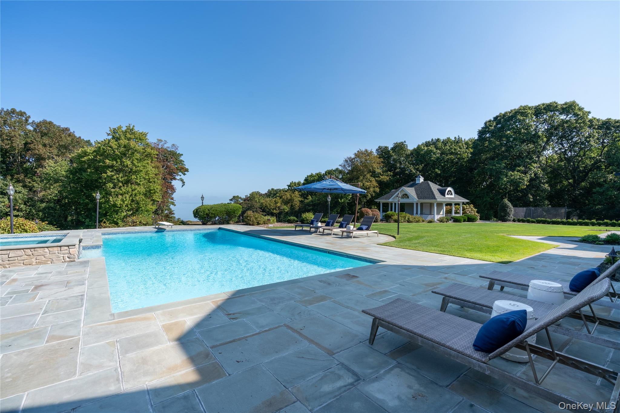697 Short Beach Road Nissequogue, NY 11780 - Photo 39 of 46 a view of a swimming pool with a yard