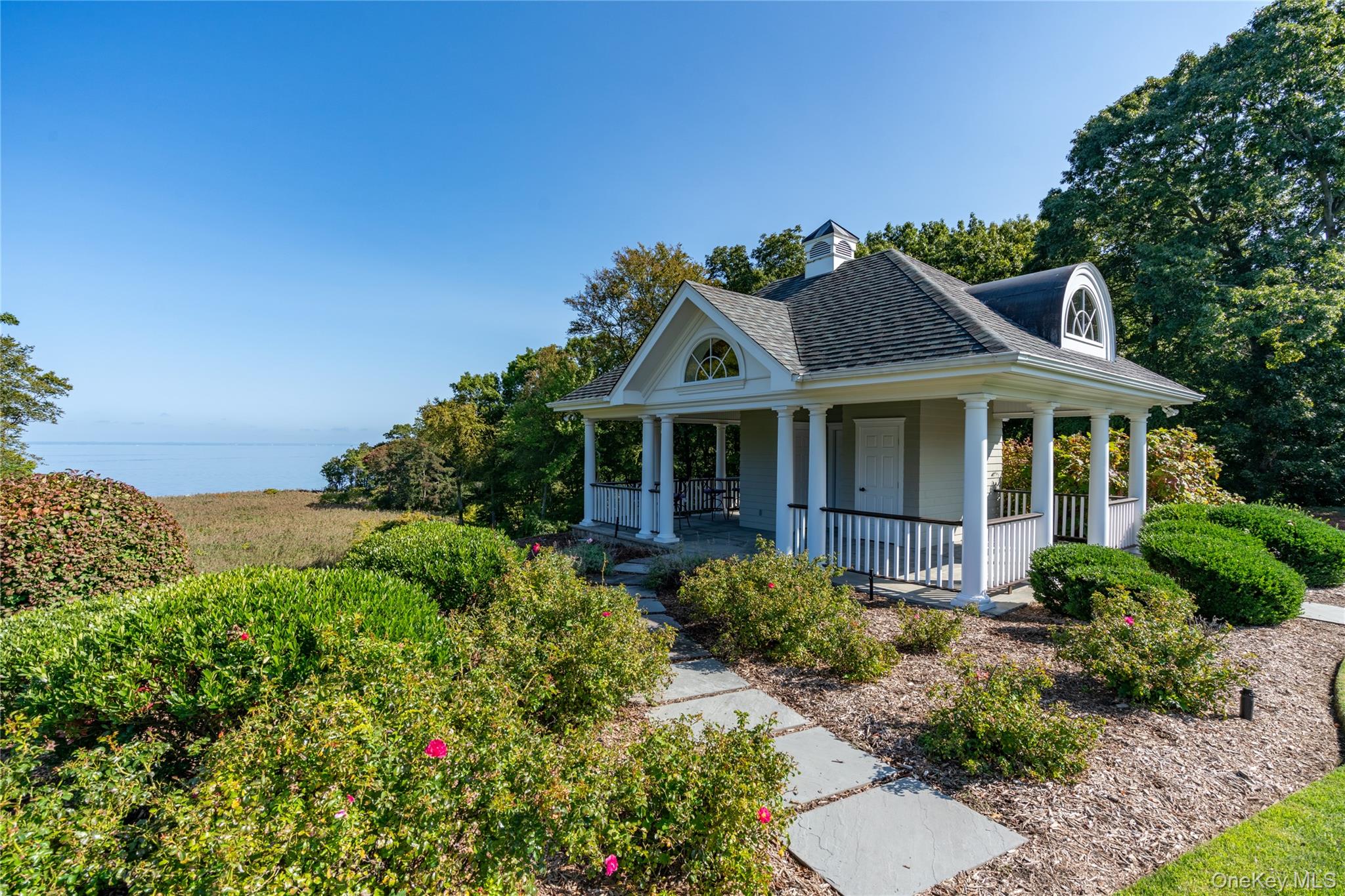 697 Short Beach Road Nissequogue, NY 11780 - Photo 41 of 46 a front view of a house with a yard