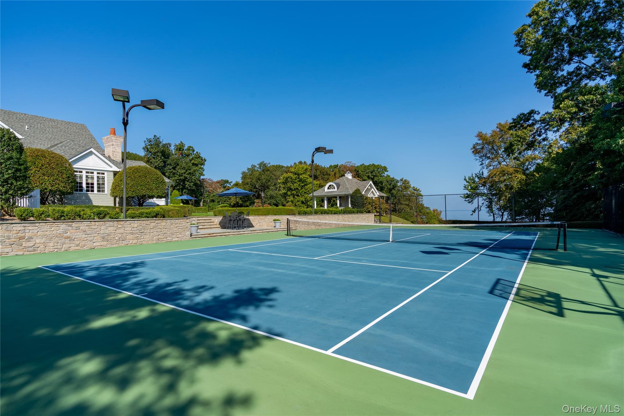 697 Short Beach Road Nissequogue, NY 11780 - Photo 42 of 46 a view of an outdoor space and basketball court