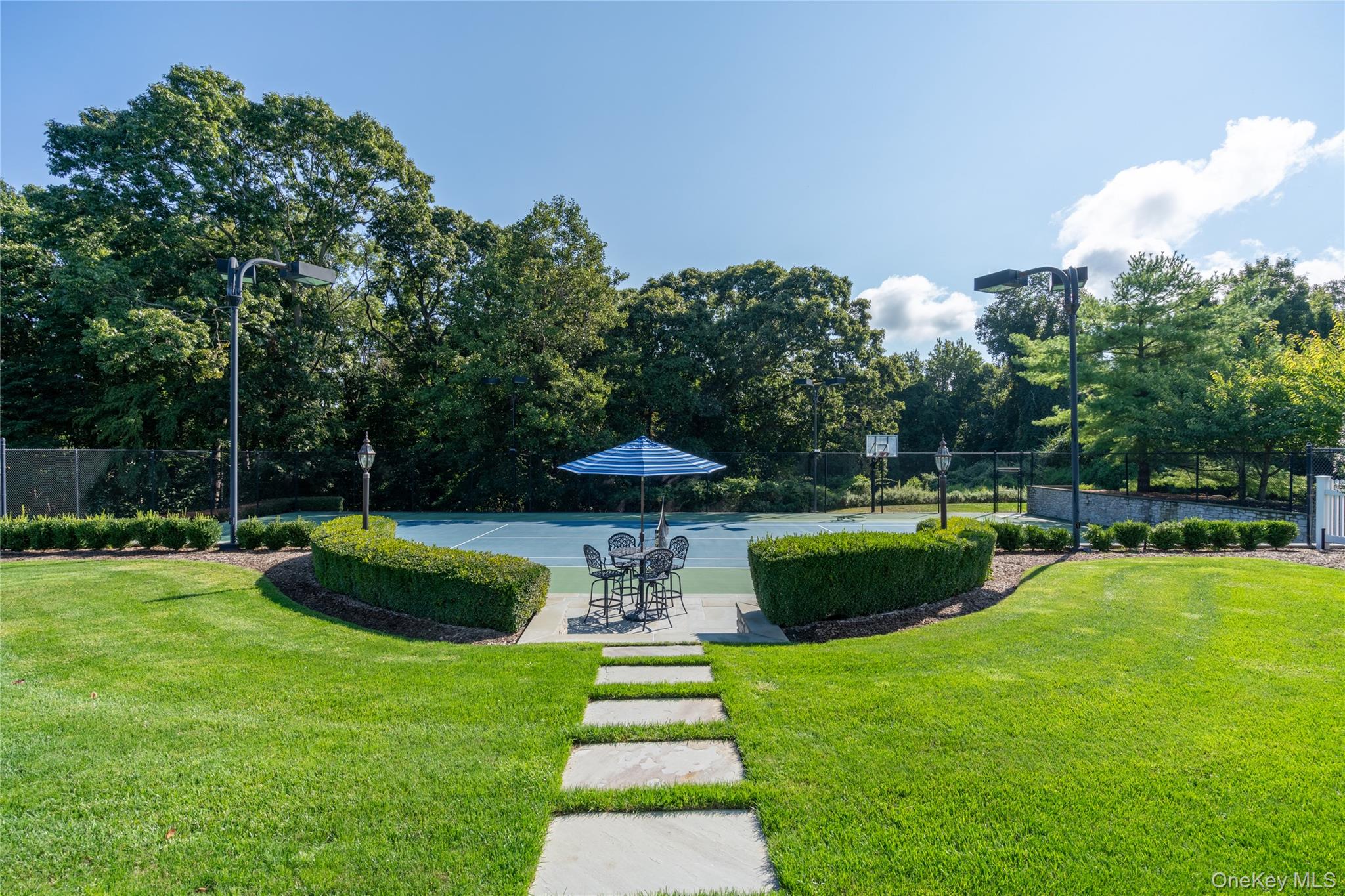 697 Short Beach Road Nissequogue, NY 11780 - Photo 43 of 46 a view of a swimming pool with a garden