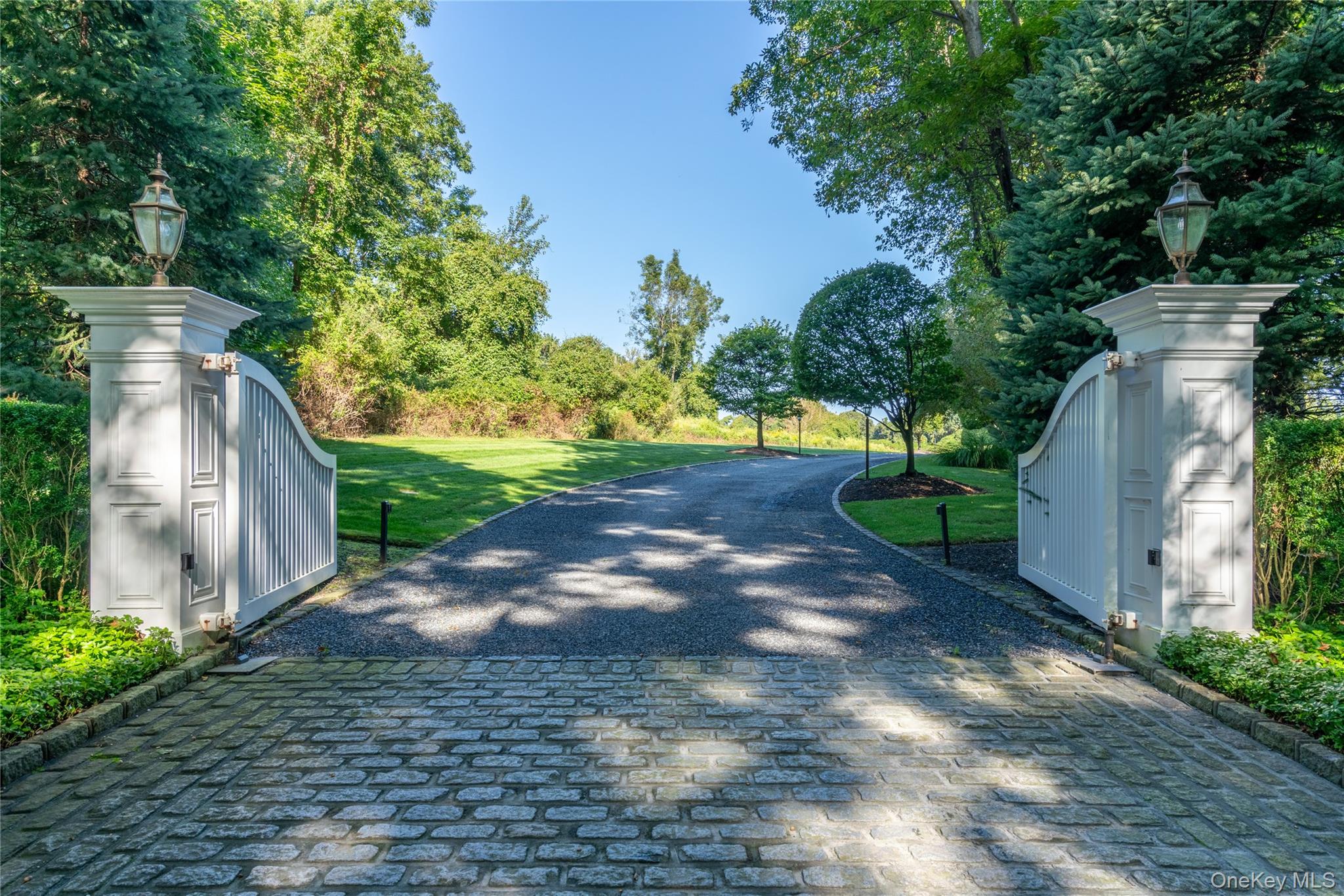 697 Short Beach Road Nissequogue, NY 11780 - Photo 5 of 46 a view of a street with a house in the background