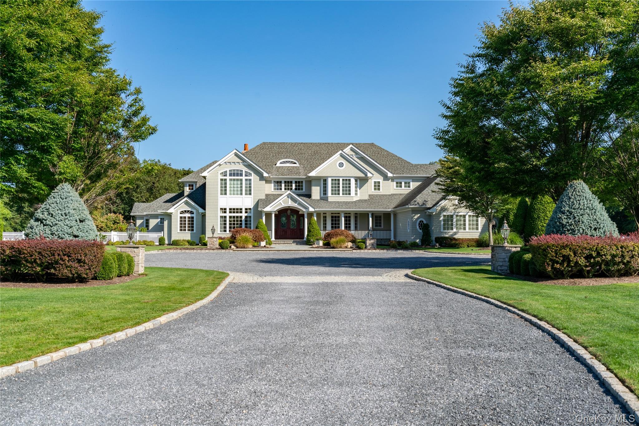 697 Short Beach Road Nissequogue, NY 11780 - Photo 7 of 46 a front view of house with yard and green space