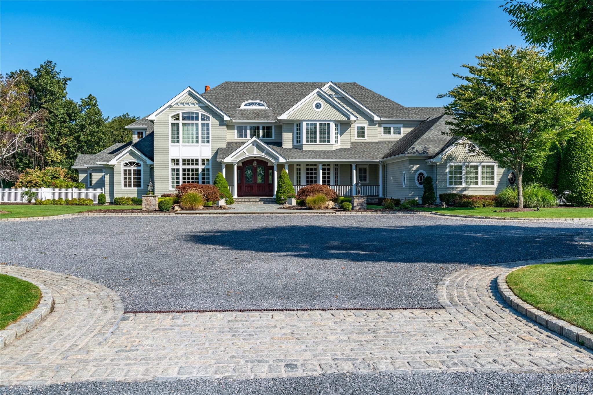 697 Short Beach Road Nissequogue, NY 11780 - Photo 8 of 46 a front view of a house with a yard