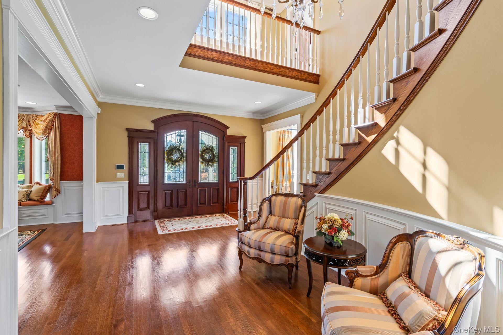 697 Short Beach Road Nissequogue, NY 11780 - Photo 10 of 46 a living room with furniture floor to ceiling windows and a rug