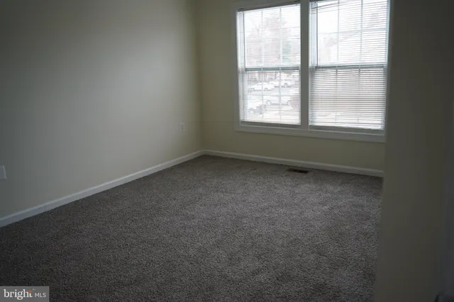 a view of a room that has a window in it
