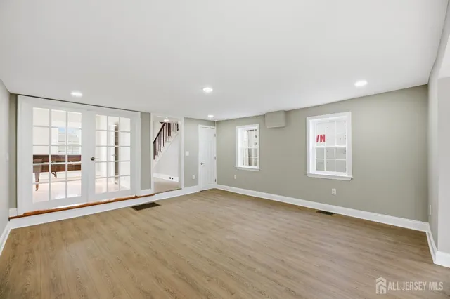 a living room with furniture a fireplace and a window