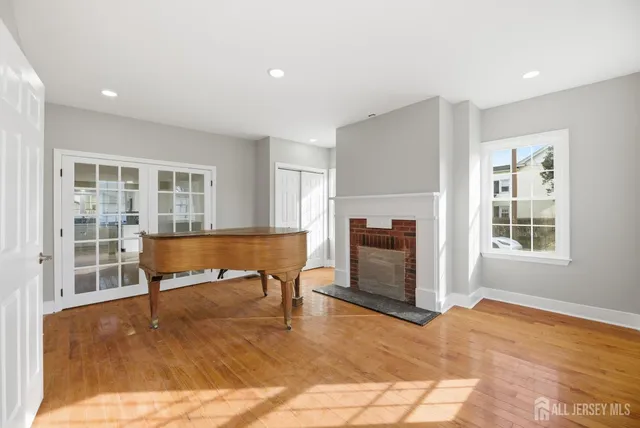 a living room with granite countertop furniture and wooden floor
