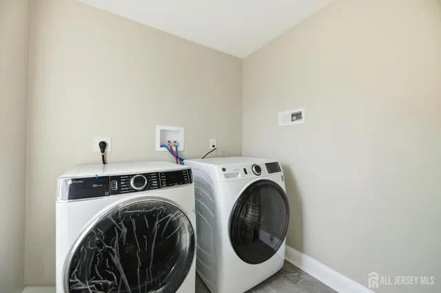 a spacious bedroom with a large bed and a shower