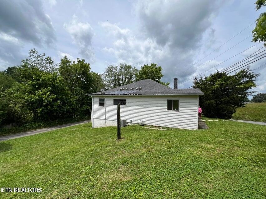 121 Sexton Lane Oneida, TN 37841 - Photo 6 of 32 a house with trees in the background