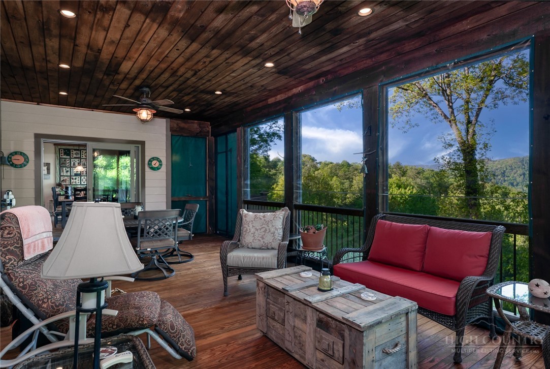 171 Camp Davis Road Banner Elk, NC 28604 - Photo 19 of 48 a outdoor space with patio the couches and pool