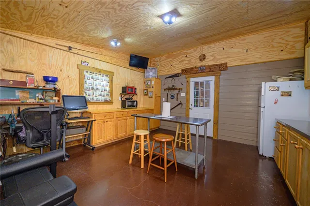 a dining room with furniture and a window